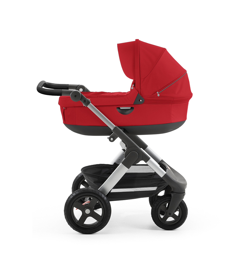 Stokke&reg; Trailz&trade; with silver chassis  and Stokke&reg; Stroller Carry Cot, Red. Leatherette Handle.